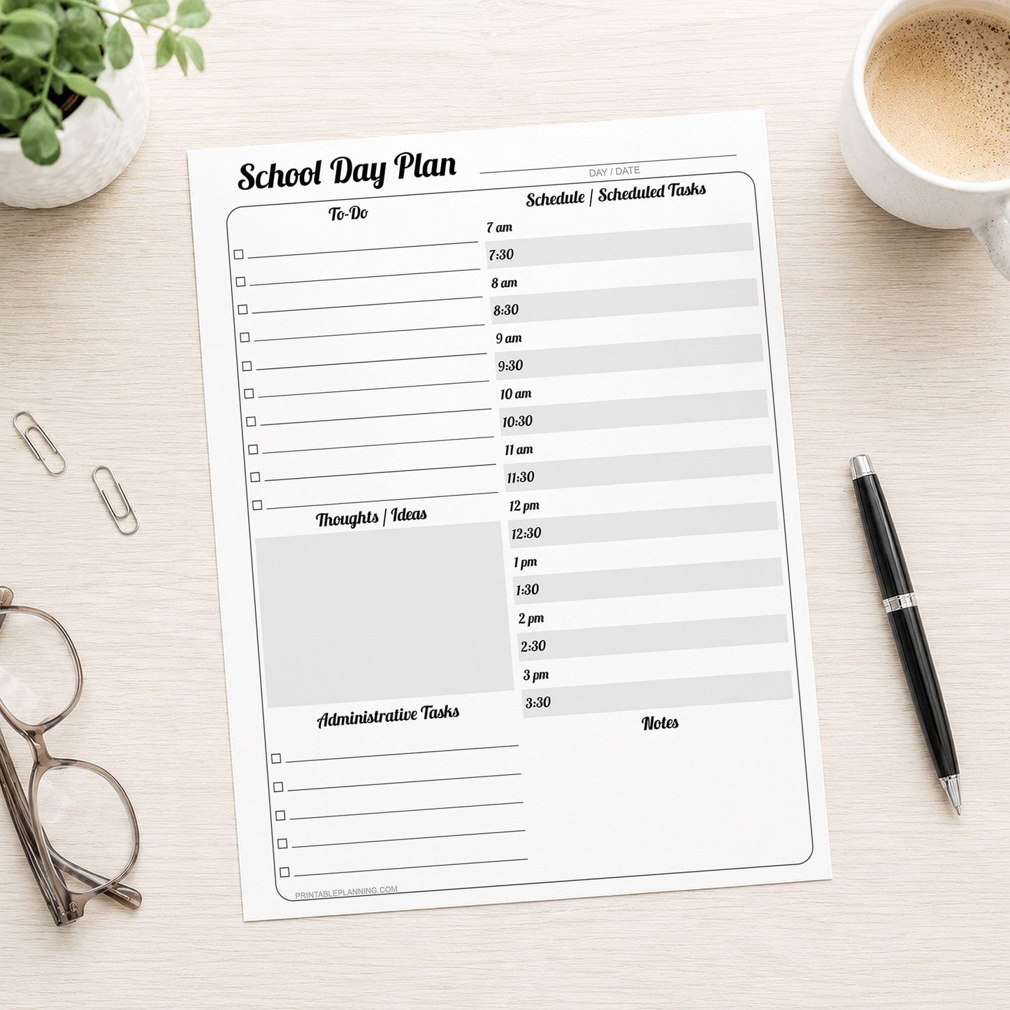 A printed School Staff Daily Planner with Schedule and To-Do List (printable page) shown on a light wooden desk with a plant, glasses, paperclips, coffee, and a pen.
