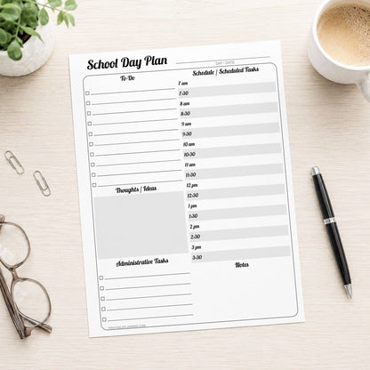 A printed School Staff Daily Planner with Schedule and To-Do List (printable page) shown on a light wooden desk with a plant, glasses, paperclips, coffee, and a pen.