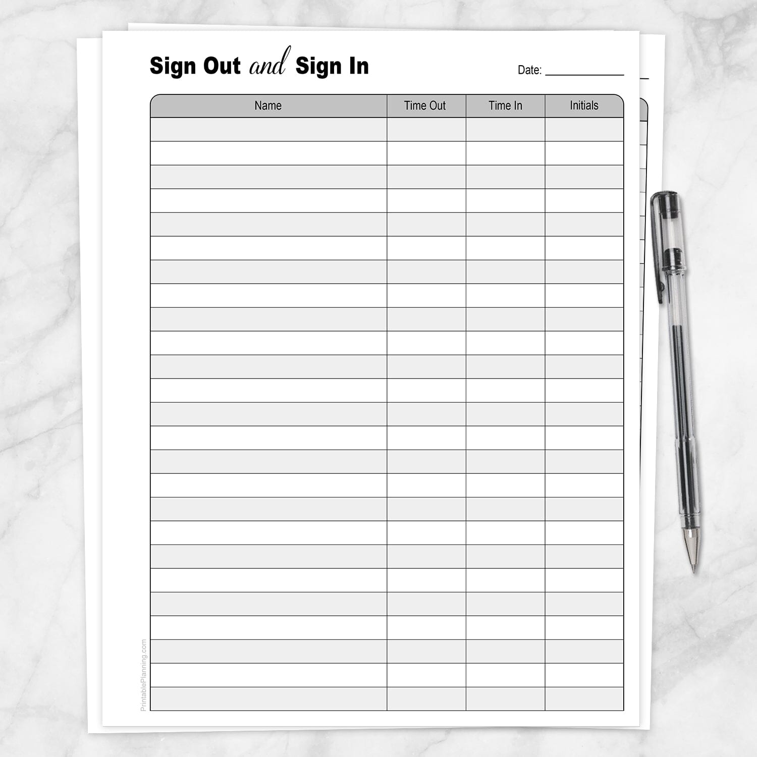 The printable Sign Out and Sign In Sheet shown on a marble surface with a pen.