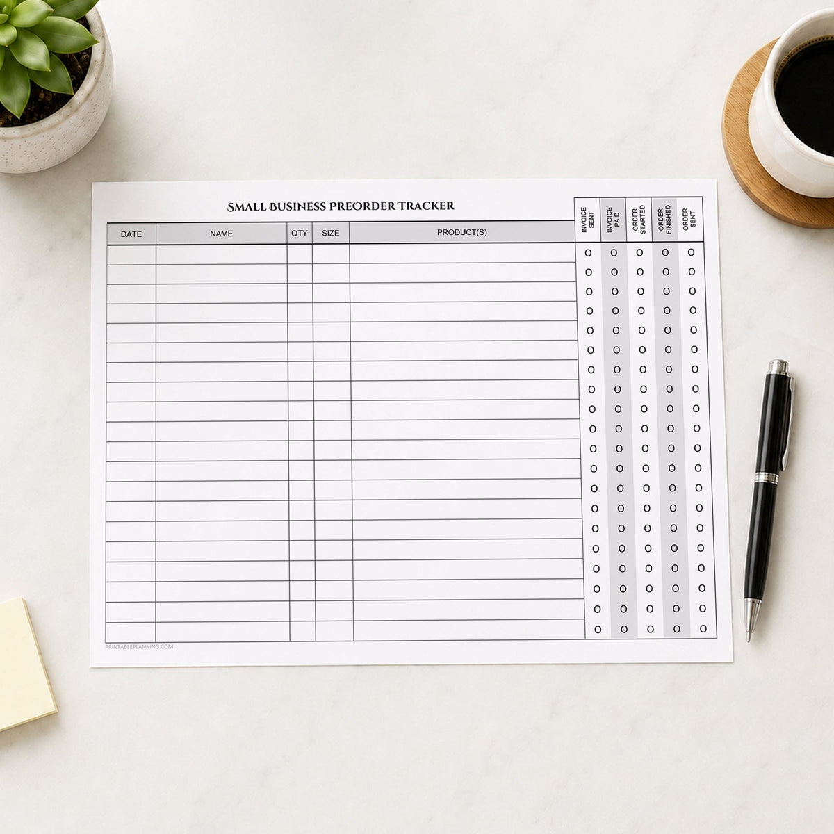 The printed Small Business Preorder Tracker with Payment & Order Status Checklist (printable) page shown on a desk with a plant, coffee, sticky notes, and a pen.