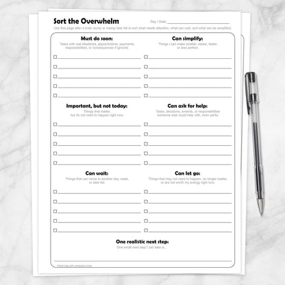 Sort the Overwhelm Printable Task Organizer shown on a marble surface with a pen.