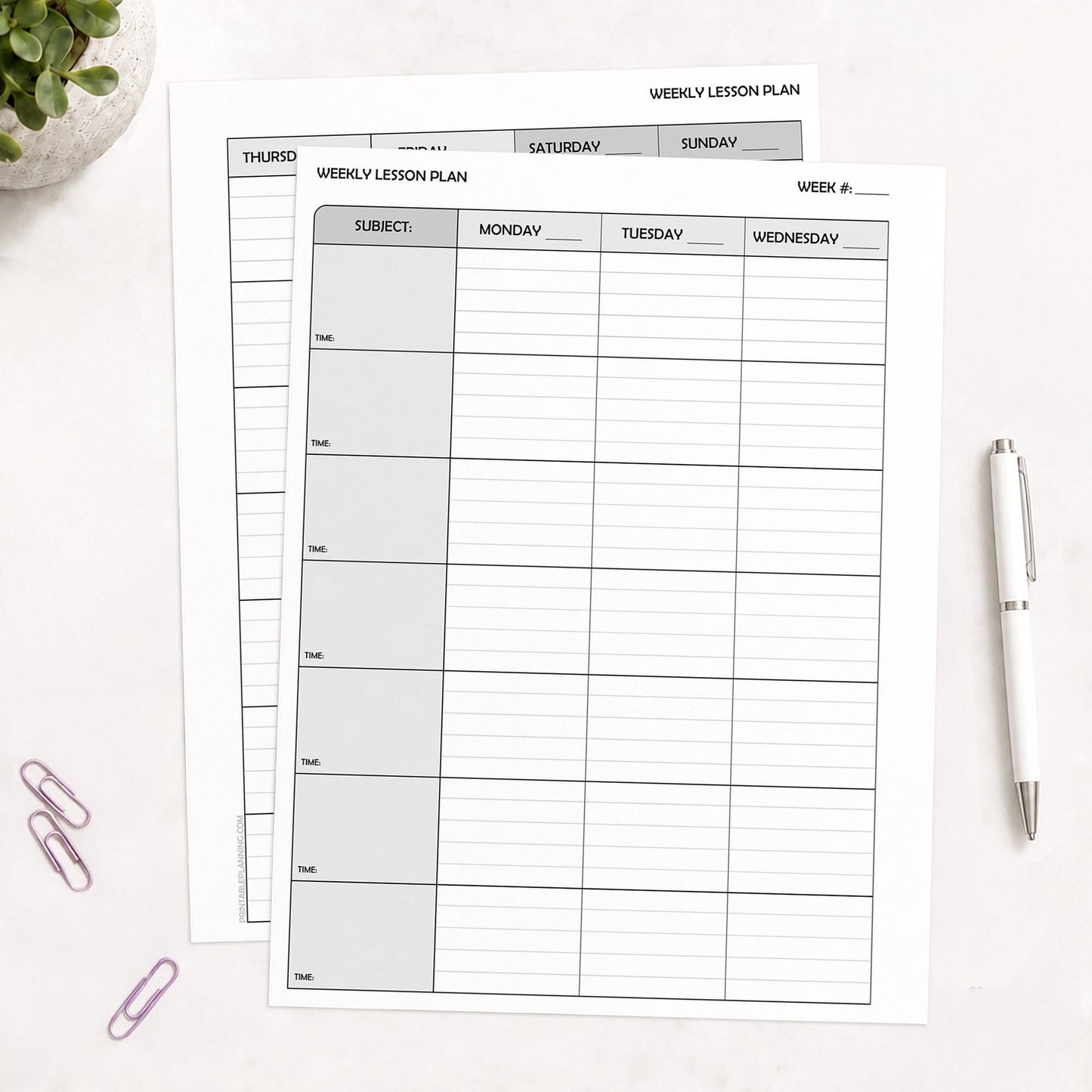 Front and back sides of the Weekly Lesson Plan Pages for Teachers - Printable School Planner PDF sheets arranged on a white desk with a white pen, purple paperclips, and a small plant visible.