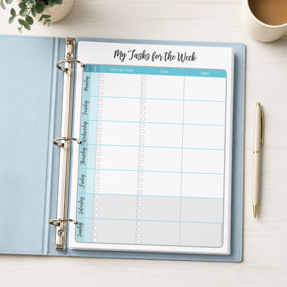The printed Turquoise Weekly Task Planner with Priorities, Checklists & Notes (printable) page shown in a light blue binder on a desk with a plant, coffee, and a pen.