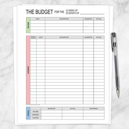 The Weekly or Monthly Budget Worksheet - Printable Income and Expense Tracker shown on a marble surface with a pen.