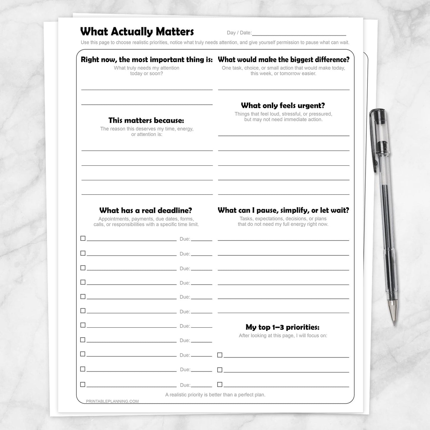 What Actually Matters Priority Worksheet shown on a marble surface with a pen.