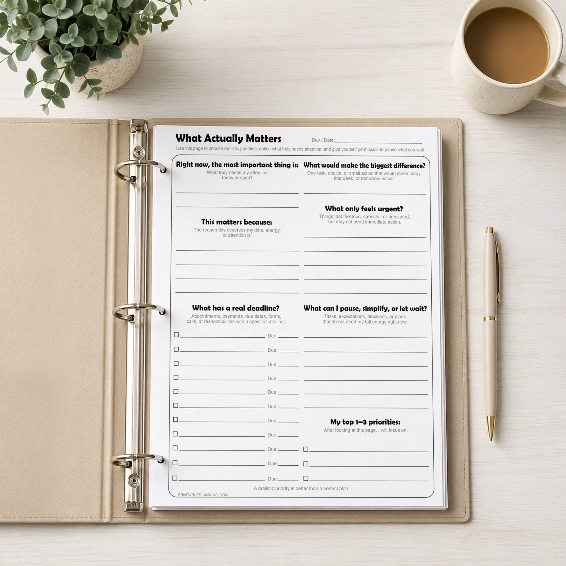 What Actually Matters Priority Worksheet shown in a binder on a desk with a pen, plant, and coffee.