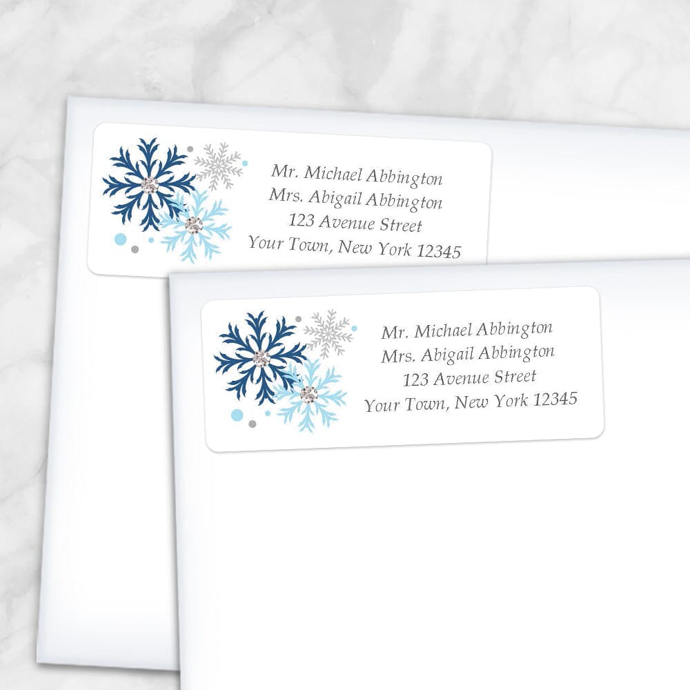 Printable Winter Blue Gray Snowflake Address Labels at Printable Planning. Shown on envelopes.