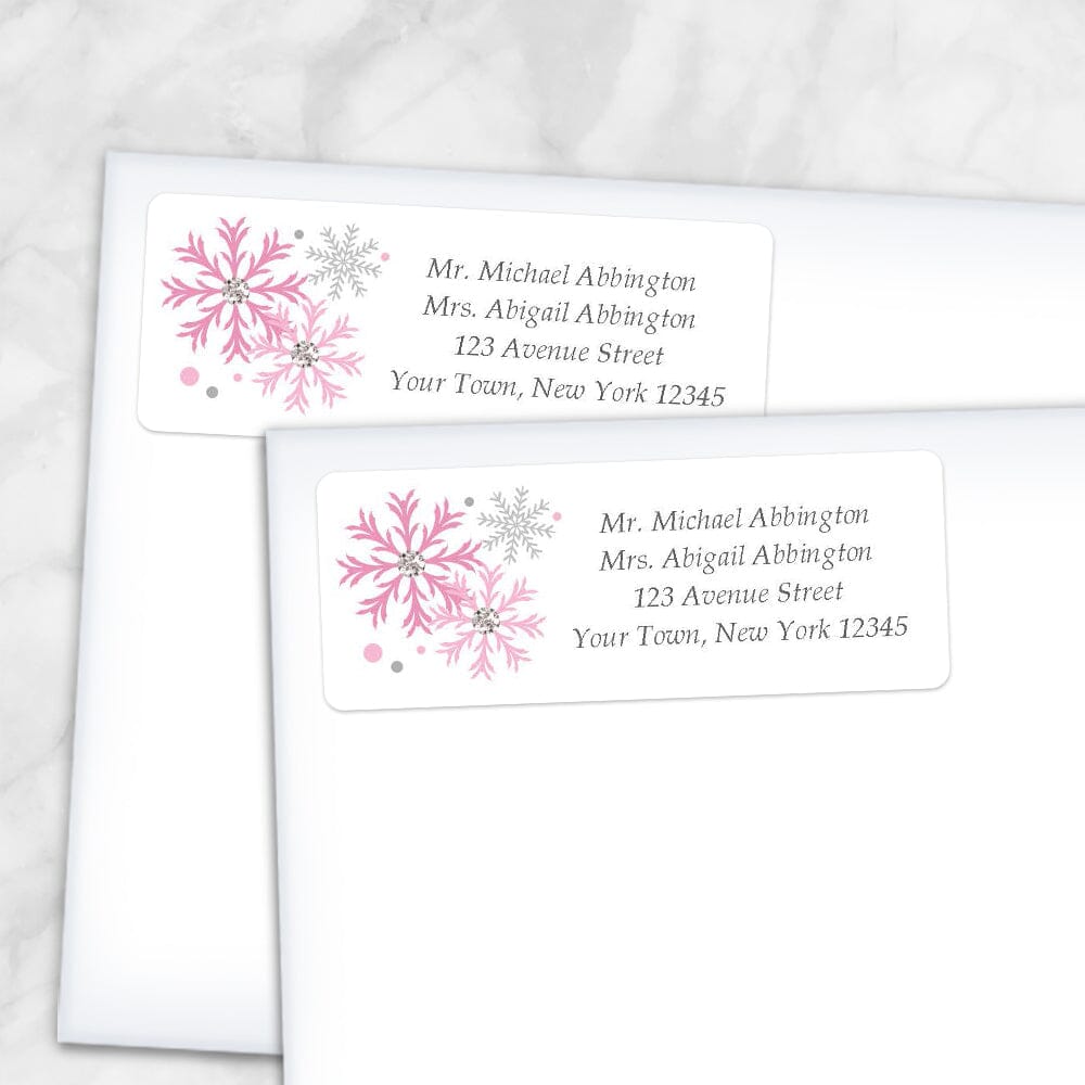 Printable Winter Pink Gray Snowflake Address Labels at Printable Planning. Shown on envelopes.