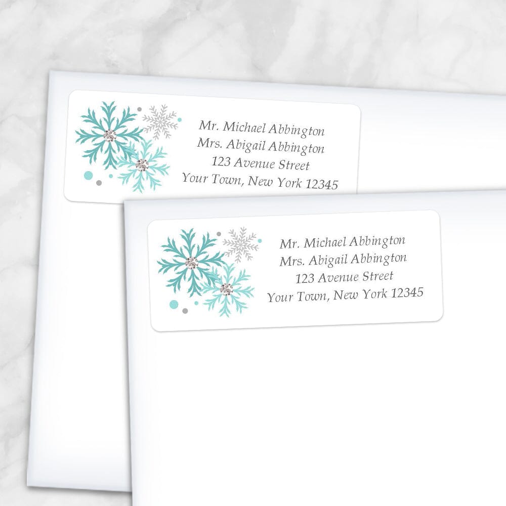 Printable Winter Turquoise Gray Snowflake Address Labels at Printable Planning. Shown on envelopes.