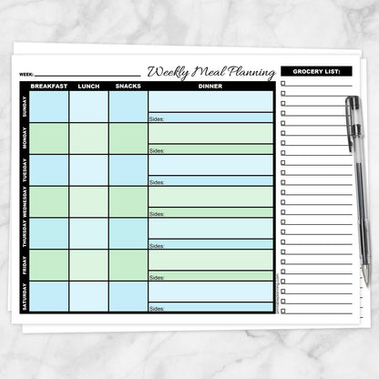 A printable Blue Green Weekly Meal Planner with Grocery List shown on a marble surface with a pen.