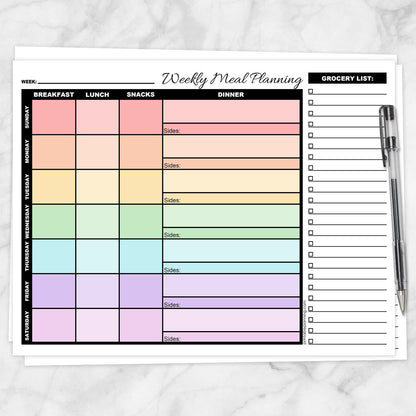Rainbow Weekly Meal Planner with Grocery List (printable page) shown on a marble surface with a pen.