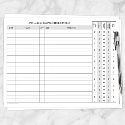 The printable Small Business Preorder Tracker with Payment & Order Status Checklist page shown on a marble surface with a pen.