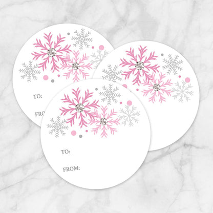 Printable Pink Snowflake Gift Tag Stickers at Printable Planning. Example of 3 stickers.